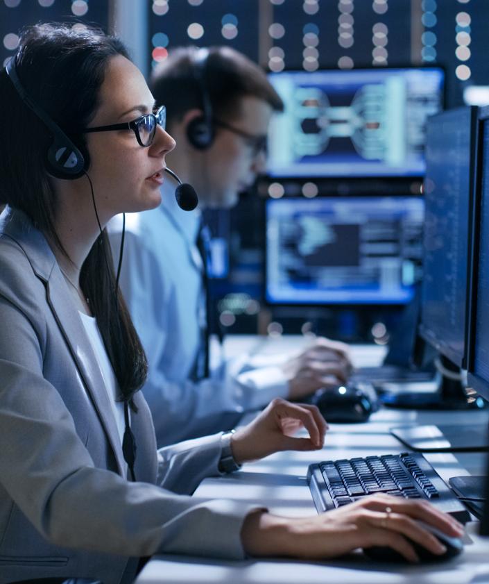 Two supply chain engineers at work with server in the background | logistics solutions | Seacon Logistics 