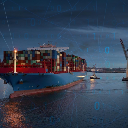 Ocean freight at night with a seaport in the   background | Seacon Logistics