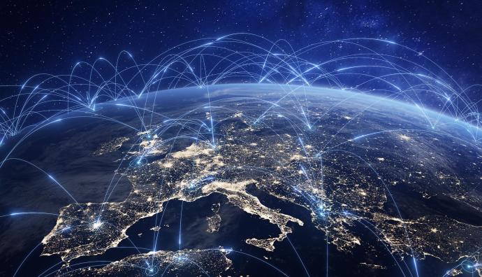 Globe seen from space with focus on Europe. Blue illuminated lines depict data flows. | Seacon Logistics