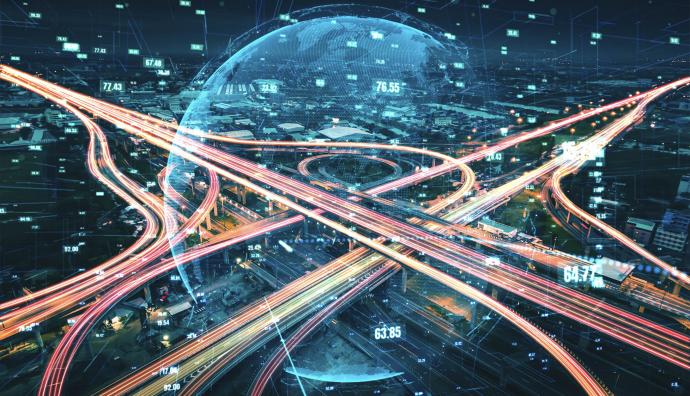 Intersection of highways in the evening. In the middle is a transparent globe representing supply chain solutions. | Seacon Logistics