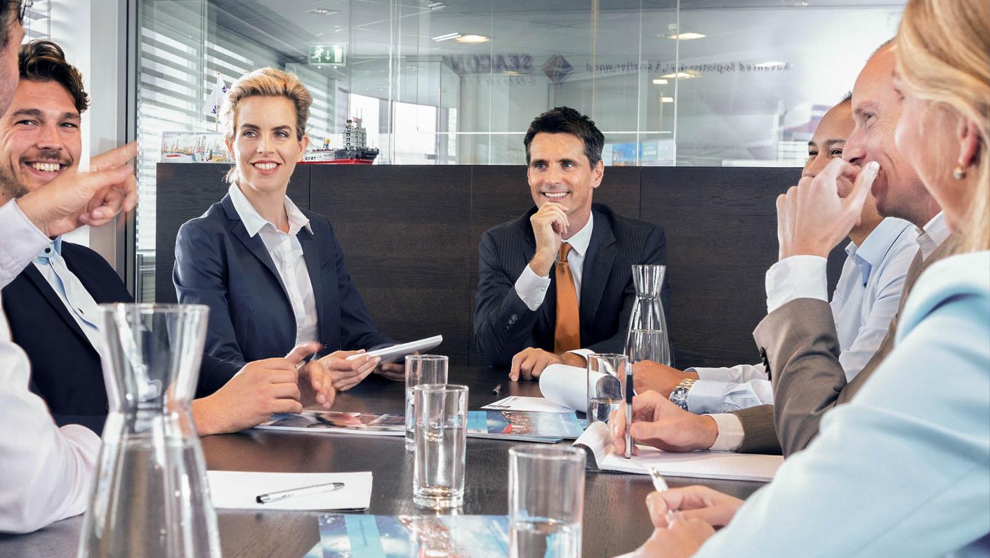 Colleagues in conversation at the office | Your logistics service provider | Seacon Logistics